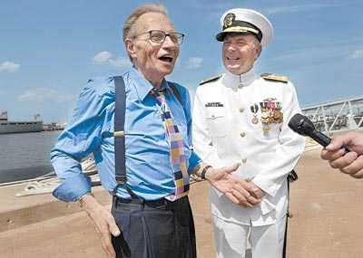 CNN's Larry King, left, shares some thoughts at the retirement ceremony for his friend Vice Adm. Al Konetzni, right, on Friday.
